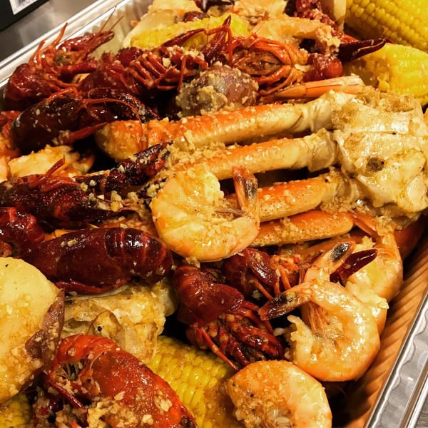 Louisiana Shack's cajun seafood boil with crawfish, shrimp, crab legs, corn, and potatoes.