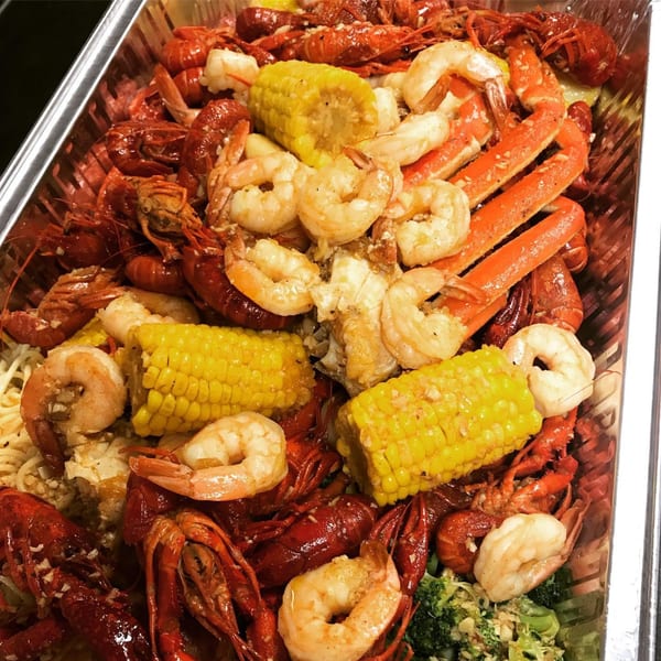 Louisiana Shack's Cajun seafood boil with crawfish, shrimp, crab legs, corn, and broccoli.